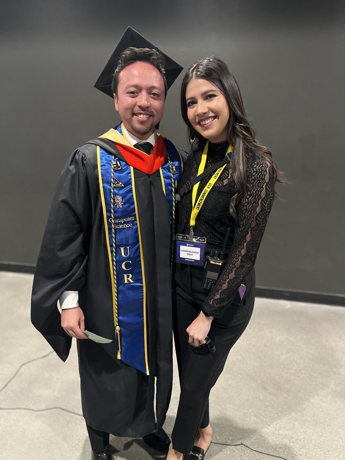 Guadalupe and Harrison at Harrison's master's degree commencement