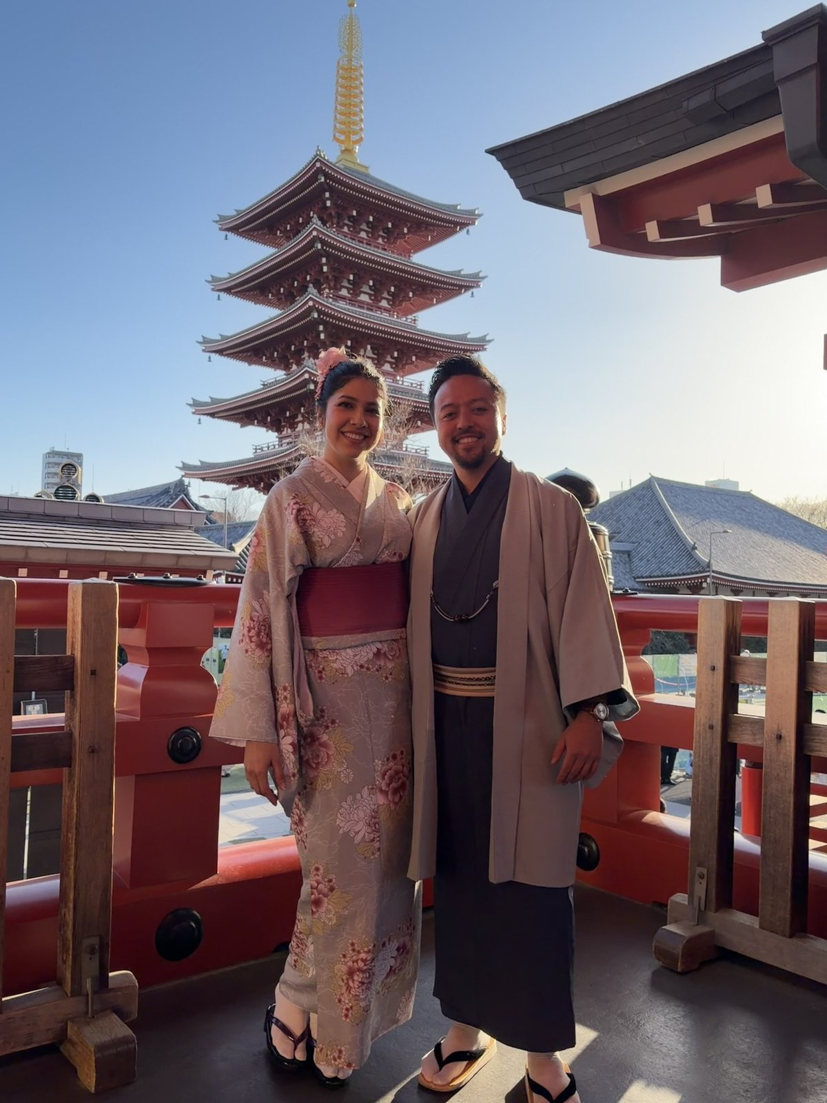 Guadalupe and Harrison in kimono in front of a five-story pagoda in Tokyo
